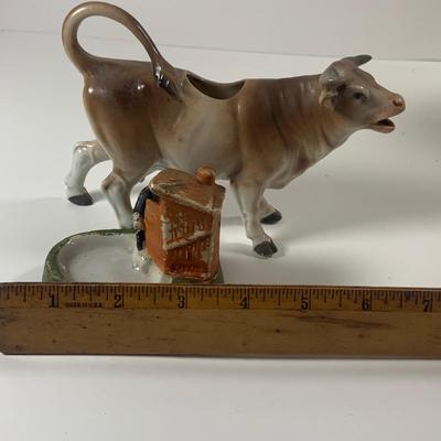 LOT 209: Vintage Black Americana McCoy Cookie Jar, a Cow Creamer and More