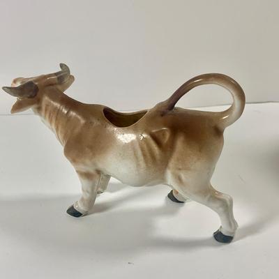 LOT 209: Vintage Black Americana McCoy Cookie Jar, a Cow Creamer and More