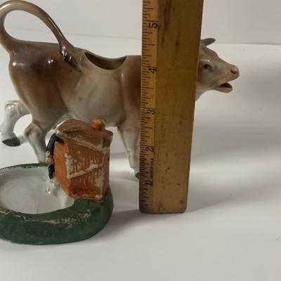 LOT 209: Vintage Black Americana McCoy Cookie Jar, a Cow Creamer and More