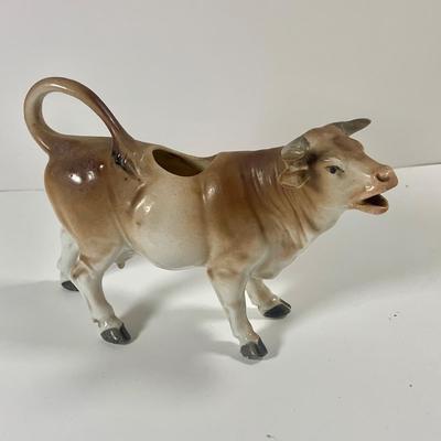 LOT 209: Vintage Black Americana McCoy Cookie Jar, a Cow Creamer and More