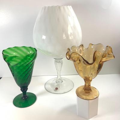 LOT 211: Beautiful Collection of Art Glass Including Large White Sniftner Goblet Made in Italy, Green Vase and Ruffled Top Amber Vase