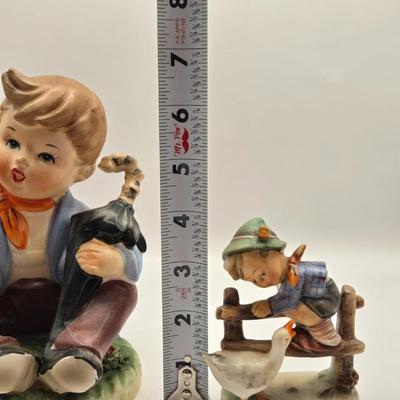 LOT 272: Enesco Boy Figure with Umbrella & Vintage Goebel HUMMEL Figure of Boy on Fence