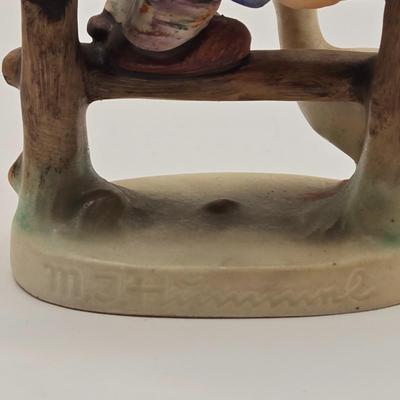 LOT 272: Enesco Boy Figure with Umbrella & Vintage Goebel HUMMEL Figure of Boy on Fence
