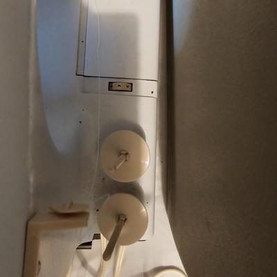 Vintage NECHI Sewing machine with sewing items and fabric