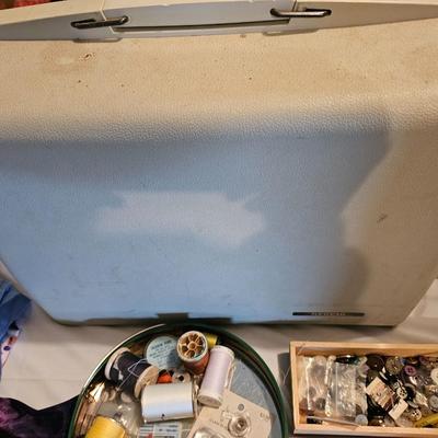Vintage NECHI Sewing machine with sewing items and fabric