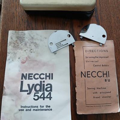 Vintage NECHI Sewing machine with sewing items and fabric