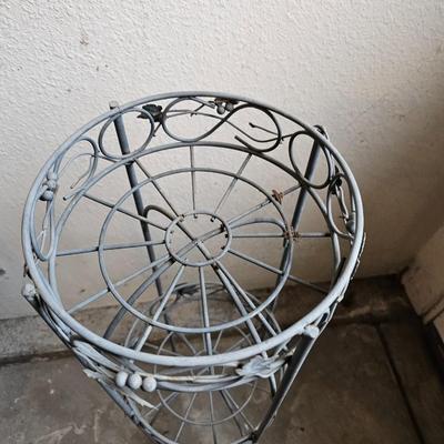 Metal plant stand with pottery pot