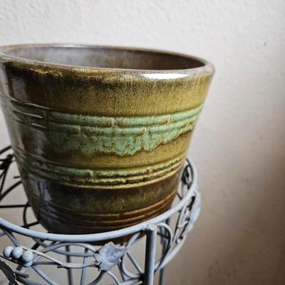 Metal plant stand with pottery pot