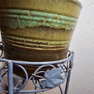 Metal plant stand with pottery pot