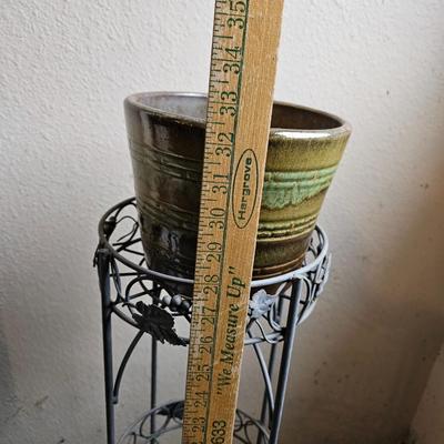 Metal plant stand with pottery pot