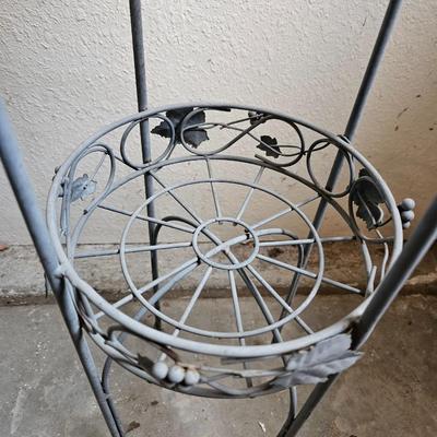 Metal plant stand with pottery pot