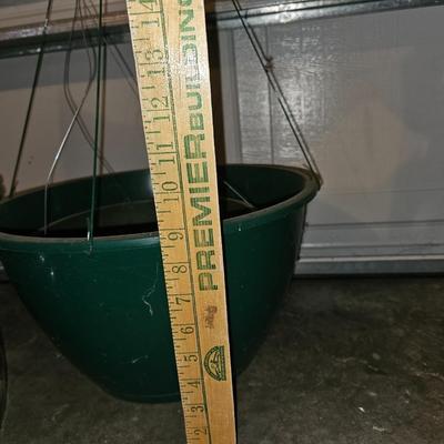 Hanging flowerpots with an assortment of other pots