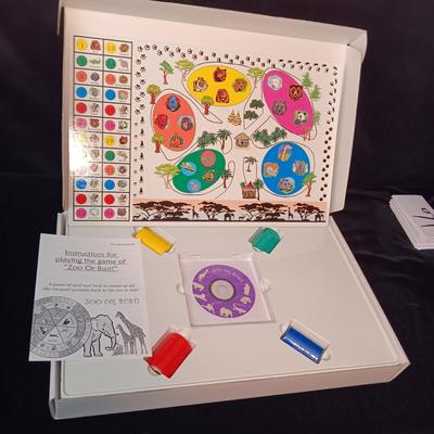 NEW "ZOO OR BUST" A GAME OF SKILL AND LUCK TO ROUND UP ALL THE ESCAPED ANIMALS BACK TO THE ZOO TO WIN!