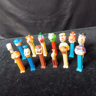 AN ASSORTMENT OF PEZ DISPENSERS