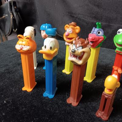 AN ASSORTMENT OF PEZ DISPENSERS