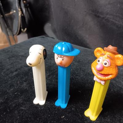 AN ASSORTMENT OF PEZ DISPENSERS