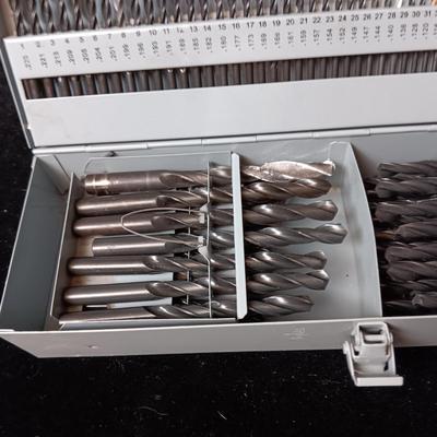 METAL HINGED BOX FULL OF FOLD UP DRILL BITS