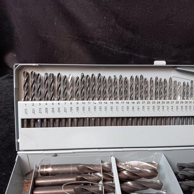 METAL HINGED BOX FULL OF FOLD UP DRILL BITS