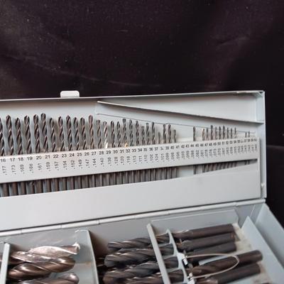 METAL HINGED BOX FULL OF FOLD UP DRILL BITS