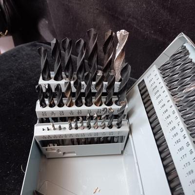 METAL HINGED BOX FULL OF FOLD UP DRILL BITS