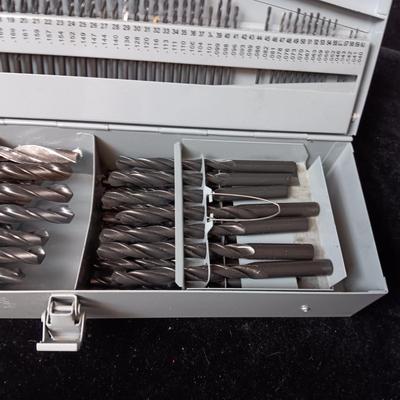 METAL HINGED BOX FULL OF FOLD UP DRILL BITS
