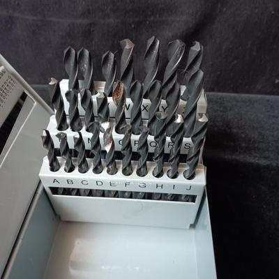METAL HINGED BOX FULL OF FOLD UP DRILL BITS