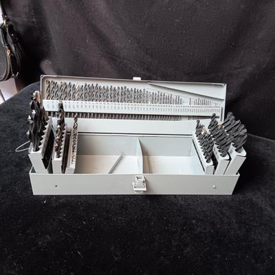 METAL HINGED BOX FULL OF FOLD UP DRILL BITS