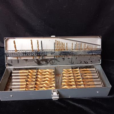 METAL HINGED BOX FULL OF FOLD UP DRILL BITS