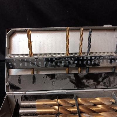 METAL HINGED BOX FULL OF FOLD UP DRILL BITS