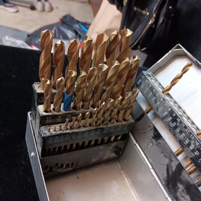 METAL HINGED BOX FULL OF FOLD UP DRILL BITS