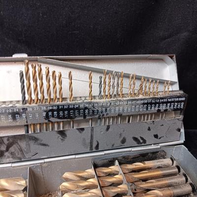 METAL HINGED BOX FULL OF FOLD UP DRILL BITS