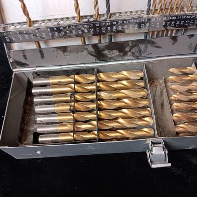 METAL HINGED BOX FULL OF FOLD UP DRILL BITS