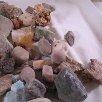 Decorative rocks, some polished with glass container