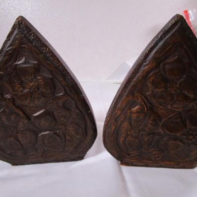 Bookends, with copper sheeting molded with flowers