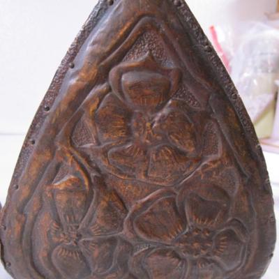 Bookends, with copper sheeting molded with flowers