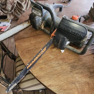 Pair of chain saws.