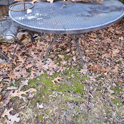 Wrought iron Patio table and 3 chairs.