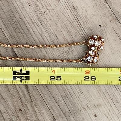 LOT 324: Opera Length Faux Glass Pearls, Lariat Gold Tone Chain with Rhinestones and Four Strand Green Faux Pearls