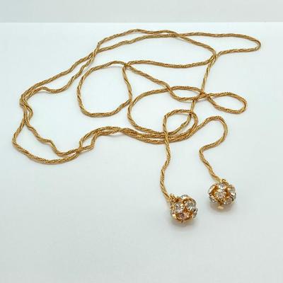 LOT 324: Opera Length Faux Glass Pearls, Lariat Gold Tone Chain with Rhinestones and Four Strand Green Faux Pearls