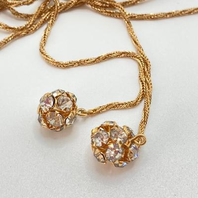 LOT 324: Opera Length Faux Glass Pearls, Lariat Gold Tone Chain with Rhinestones and Four Strand Green Faux Pearls