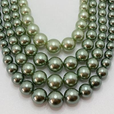 LOT 324: Opera Length Faux Glass Pearls, Lariat Gold Tone Chain with Rhinestones and Four Strand Green Faux Pearls