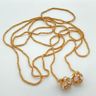 LOT 324: Opera Length Faux Glass Pearls, Lariat Gold Tone Chain with Rhinestones and Four Strand Green Faux Pearls