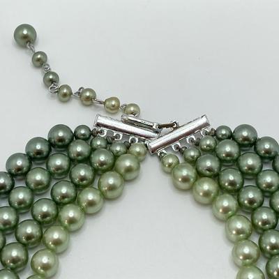 LOT 324: Opera Length Faux Glass Pearls, Lariat Gold Tone Chain with Rhinestones and Four Strand Green Faux Pearls