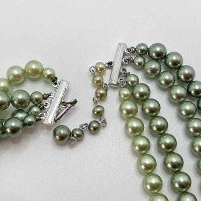 LOT 324: Opera Length Faux Glass Pearls, Lariat Gold Tone Chain with Rhinestones and Four Strand Green Faux Pearls