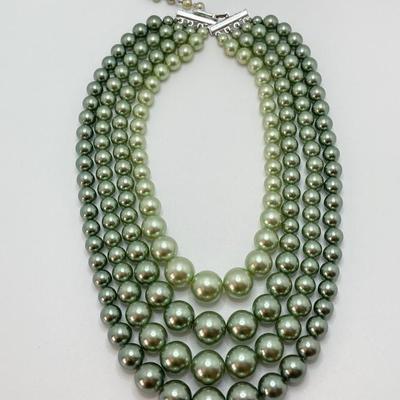LOT 324: Opera Length Faux Glass Pearls, Lariat Gold Tone Chain with Rhinestones and Four Strand Green Faux Pearls
