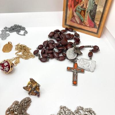 LOT 609: Religious Collection - Stone Pendant w/Gold Tone Chain, Crystal Heart Pendant w/Cross, Red Enamel & Rhinestone Guardian...