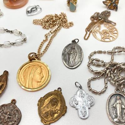 LOT 609: Religious Collection - Stone Pendant w/Gold Tone Chain, Crystal Heart Pendant w/Cross, Red Enamel & Rhinestone Guardian...