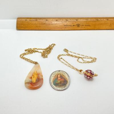 LOT 609: Religious Collection - Stone Pendant w/Gold Tone Chain, Crystal Heart Pendant w/Cross, Red Enamel & Rhinestone Guardian...