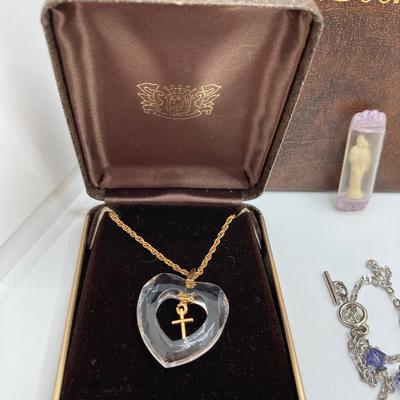 LOT 609: Religious Collection - Stone Pendant w/Gold Tone Chain, Crystal Heart Pendant w/Cross, Red Enamel & Rhinestone Guardian...