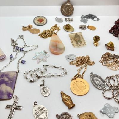 LOT 609: Religious Collection - Stone Pendant w/Gold Tone Chain, Crystal Heart Pendant w/Cross, Red Enamel & Rhinestone Guardian...